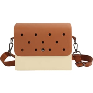 A briefcase in tan and cream with perforated detailing and a detachable strap. It features a logo on the front.