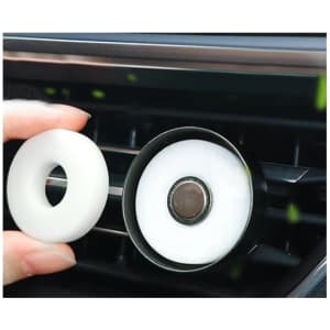 A car clip air freshener in black with a white inner circle, designed to attach to car vents.