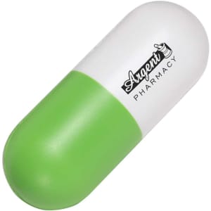 A capsule-shaped stress reliever in green and white, featuring a logo.