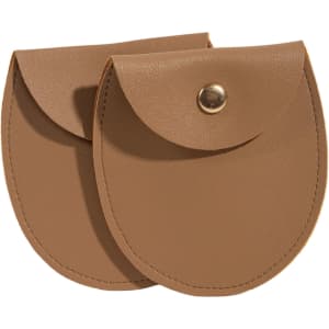 A pair of oval brown PU leather jewelry pouches with snap closures and a sleek design.