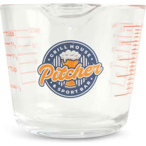 A clear glass measuring jug with red measurement markings and a logo on the front.