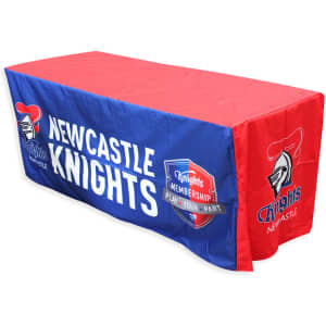 A 6ft tablecloth featuring red and blue colours with a logo and text related to Newcastle Knights.
