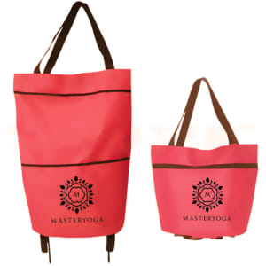 A pink collapsible shopping trolley bag with brown straps, featuring a logo on the front.