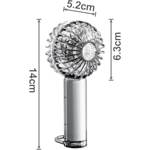 A transparent handheld fan with LED light, featuring a silver handle and a decorative fan head.