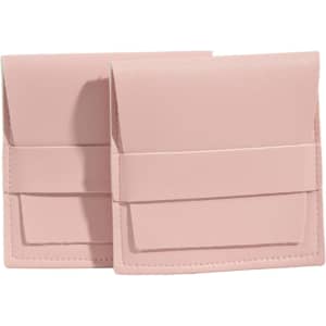 A set of two pink PU leather flip jewelry pouches with a secure closure and neat stitching.