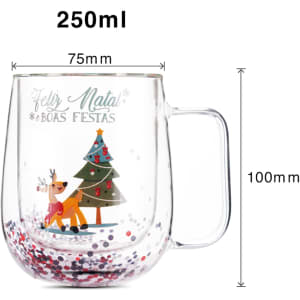 A Christmas double wall mug with a transparent design, featuring a reindeer, a tree, and colourful glitter inside.