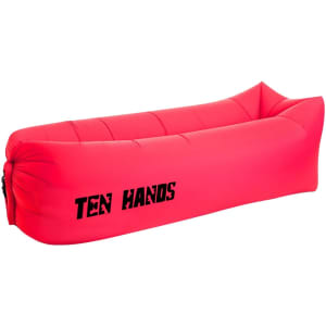 A bright pink inflatable lazy bed with a logo on the side. It features a simple, elongated design.