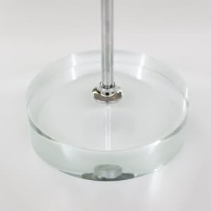 A clear circular base with a metal rod, designed for displaying desk flags.
