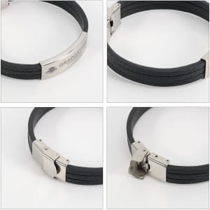 A black multi-layer leather bracelet featuring a silver clasp and an engraved logo.