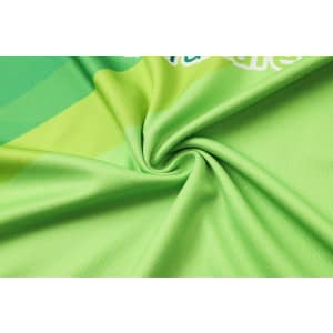 A vibrant green micro mesh fabric featuring a subtle pattern, perfect for a long-sleeved polo shirt, with a logo present.