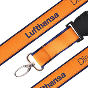 A detailed woven lanyard in orange and navy, featuring a clip and a branding logo.