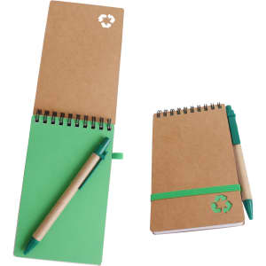A spiral notebook with a green interior and a green ballpoint pen, featuring a recycled material design.