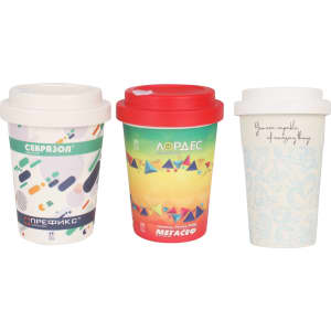 A set of three reusable bamboo coffee cups featuring various colourful designs and screw lids. Each cup has a distinct pattern.