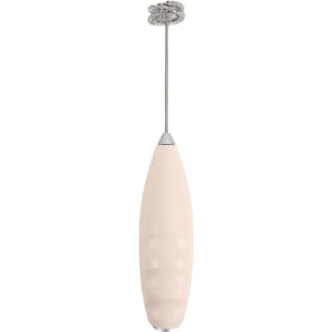 A milk frother in a soft pink hue with a silver whisk attachment, featuring a sleek, elongated design.