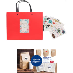 A red knitted handle bag with a laminated surface and assorted stickers displayed beside it.