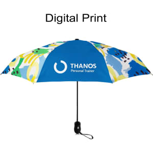 A light mini auto umbrella with a blue, yellow, and green abstract design and a logo on one panel.