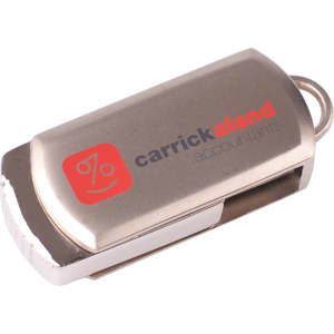 A silver flash drive with a metallic finish and a logo on one side.