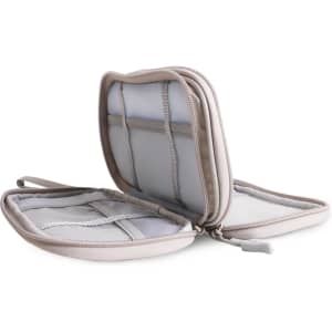 A beige electronic accessory organiser bag featuring multiple compartments and zippered closures.