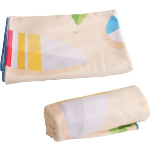 A microfibre beach towel featuring a colourful design with patterns in yellow, blue, and green. It has a logo.