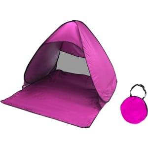 A pink pop-up beach tent with a matching carry bag, designed for sun protection.