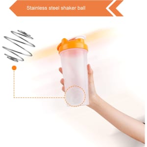 A drink bottle with an orange lid and a clear body, featuring a stainless steel shaker ball inside.