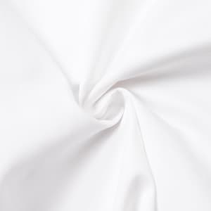 A close-up view of smooth, white fabric, showcasing its texture and appearance.