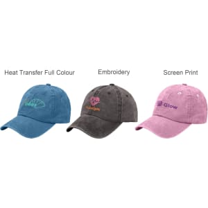 A collection of three 6 panel vintage washed baseball caps in blue, grey, and pink, featuring various logos.