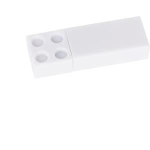 A white stackable brick flash drive with a smooth finish and four circular indentations on one end.