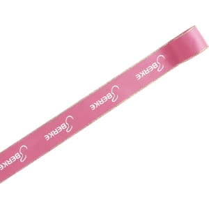 A pink ribbon with gold edges, featuring a branding logo, categorized under print ribbons.