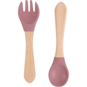 A set of ergonomic silicone kids cutlery featuring a pink fork and scoop with wooden handles.