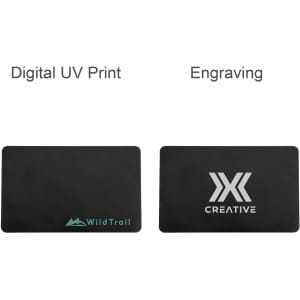 A black metal business card featuring a logo, with options for digital UV print and engraving on either side.