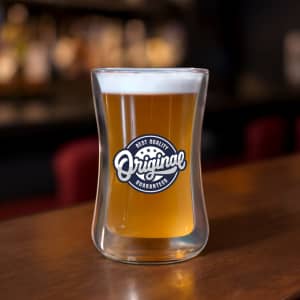 A drink bottle with a double wall glass design, featuring a light amber beverage and a circular logo.