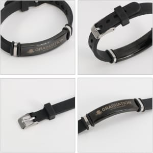 A black engraved bracelet featuring a silver clasp and a logo, showcased from multiple angles.