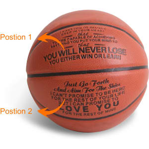 A PU basketball in orange with textured surface and a logo, featuring motivational text in black on two positions.