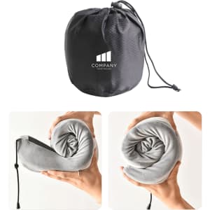 A grey memory foam U-shaped travel pillow rolled and stored in a black pouch with a logo.