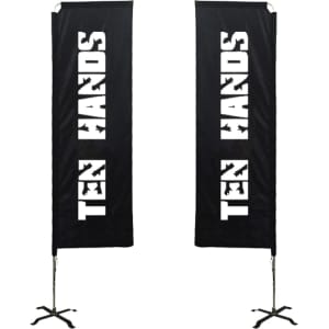 Two large rectangular banners in black with a logo. They are mounted on stands.