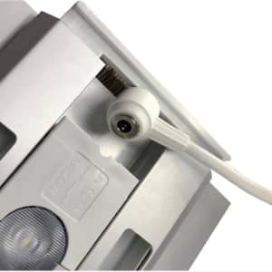 A close-up of a white SEG backlit LED light box display showcasing its connection point and details.