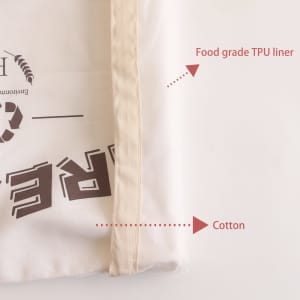 A reusable linen bread bag featuring a cotton exterior and food-grade TPU liner. The bag has a neutral colour scheme.