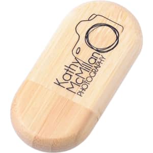 An oblong wood flash drive in natural wood tones with a logo design on the surface.