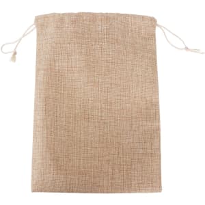 A small jute produce bag in a natural beige colour with drawstring closure and a textured fabric.