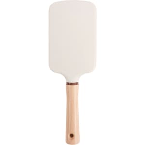 A paddle brush with a white head and a light wooden handle, featuring a circular hole at the base.