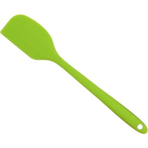 A green spatula with a flat, flexible head and a long handle. It features a hole for easy hanging.