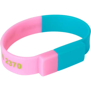 A sectional wristband flash drive in pink and turquoise, featuring a rectangular connector and a logo.