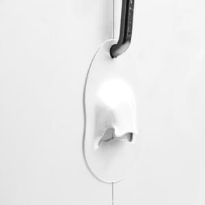 A sleek white metal cooler box featuring a bottle opener on the side.