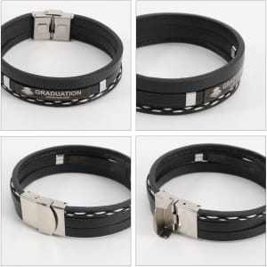 A multi-layer braided leather bracelet in black, featuring metal accents and a clasp. Includes a logo detail.
