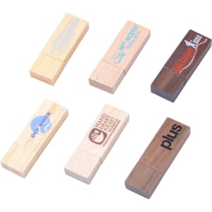 A collection of wooden flash drives in various finishes, featuring logos and promotional designs.