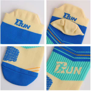 A pair of No Show Running Socks in blue and cream, featuring a logo and vibrant patterns.
