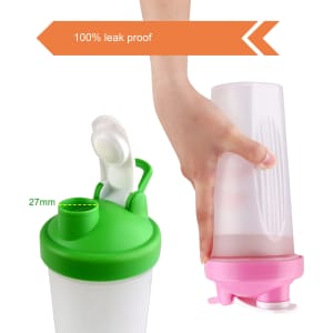 A drink bottle with a green lid and pink base, featuring a loop and a transparent body. It has a logo.