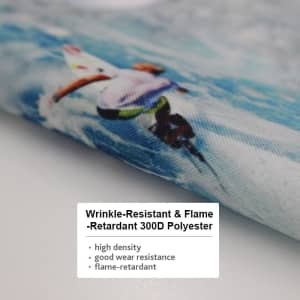 A close-up of a textured fabric featuring a design with water and a person surfing. The fabric is polyester.