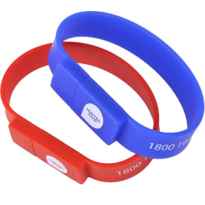 Two silicone wristband flash drives in red and blue, featuring a logo on each band.